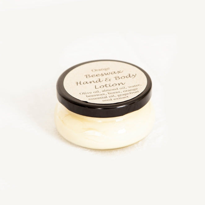 Jar of orange beeswax hand and body lotion 